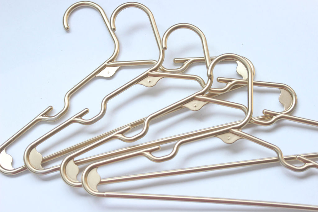 DIY Gold Plastic Hangers tutorial using spray paint. 